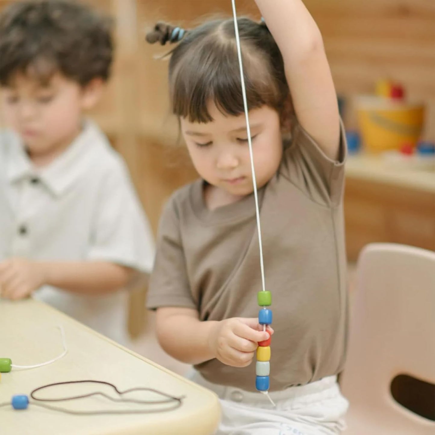 PlanToys® Threading Beads | Montessori Wooden Bead Stringing Toy for Toddlers 6M+ | Develops Fine Motor Skills, Hand-Eye Coordination & Sequencing | 60 Beads with 3 Strings & Storage Box