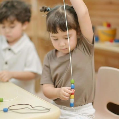 PlanToys® Threading Beads | Montessori Wooden Bead Stringing Toy for Toddlers 6M+ | Develops Fine Motor Skills, Hand-Eye Coordination & Sequencing | 60 Beads with 3 Strings & Storage Box