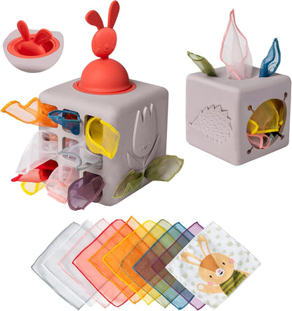 Taf Toys Baby Tissue Box Toy Silicone Baby Toys 6-12 Months Montessori Toys Sensory Activity & 10 Tissues for Fine Motor Development Soft Interactive Silicone Learning Cube for 1 Year Old Toddlers