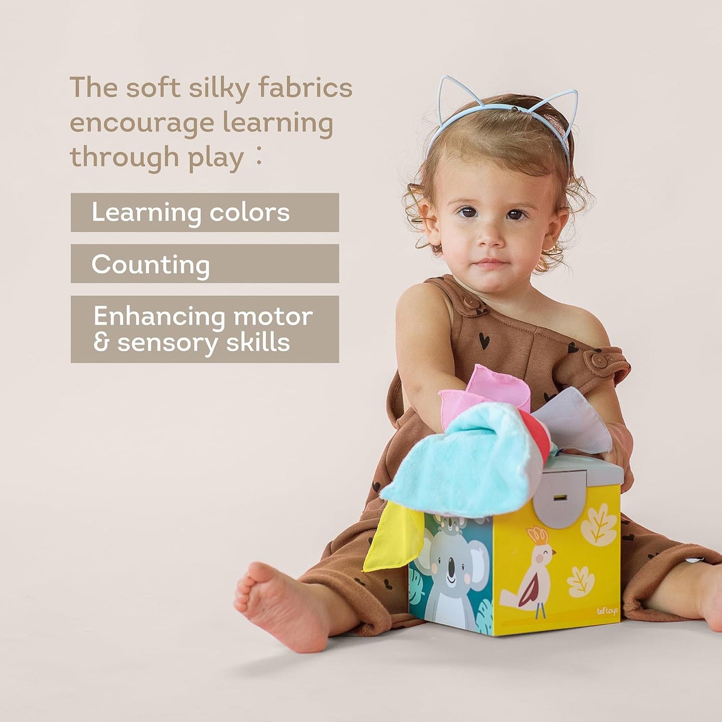 Taf Toys Baby Tissue Box Toy Silicone Baby Toys 6-12 Months Montessori Toys Sensory Activity & 10 Tissues for Fine Motor Development Soft Interactive Silicone Learning Cube for 1 Year Old Toddlers