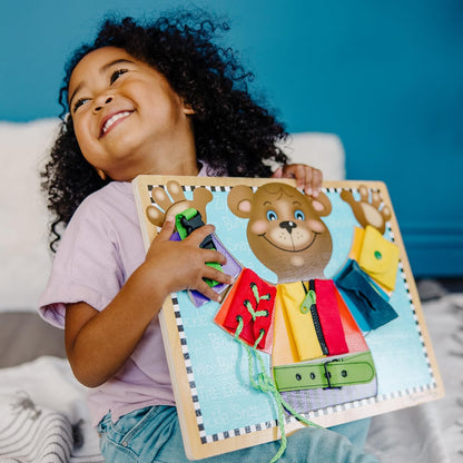 Melissa & Doug Basic Skills Puzzle Board - Wooden Educational Toy Learn to Button Busy Board, Activity for Fine Motor Skills, Developmental Toy for Toddlers Ages 3+
