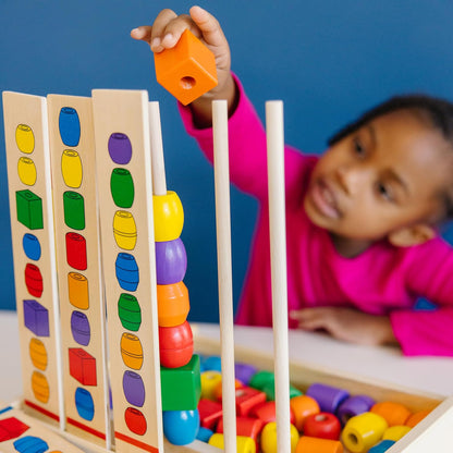 Melissa & Doug Bead Sequencing Set with 46 Wooden Beads and 5 Double-Sided Pattern Boards